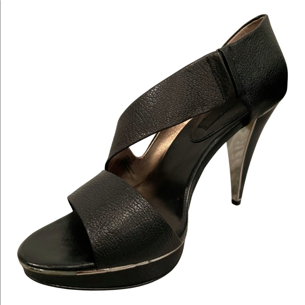 Black genuine leather Banana Republic heels size 6.5. Shoes run slightly big.